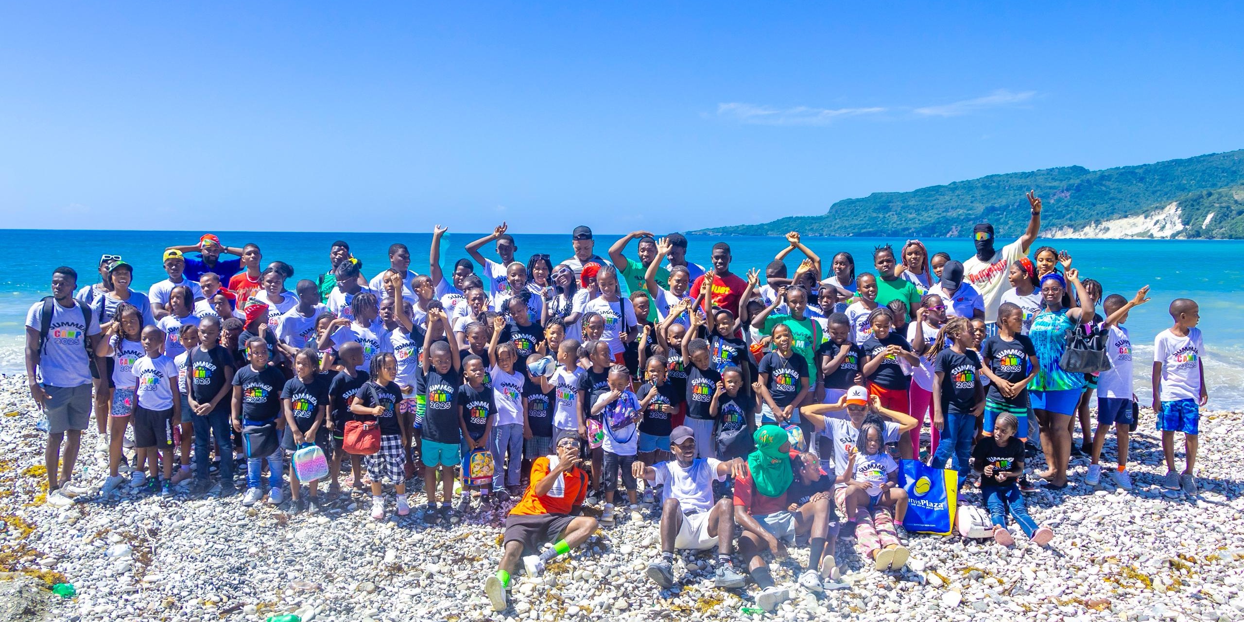Summer Camp 2025 group photo at the beach